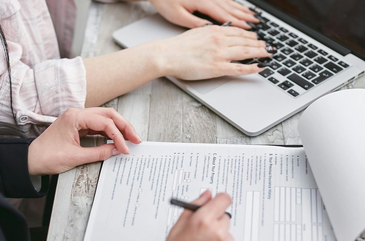 two colleagues working together on documents