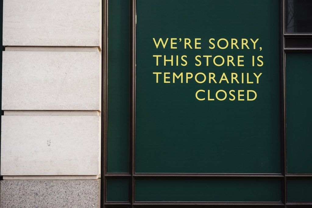 a sign indicating "temporarily closed" displayed on the entrance of a building