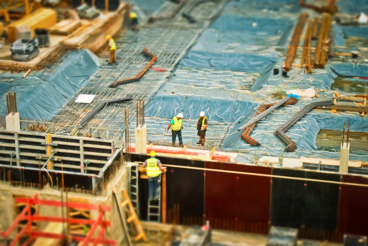 group of construction workers engaged in tasks at a construction site