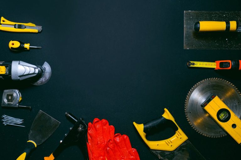 an assortment of tools displayed on a black table