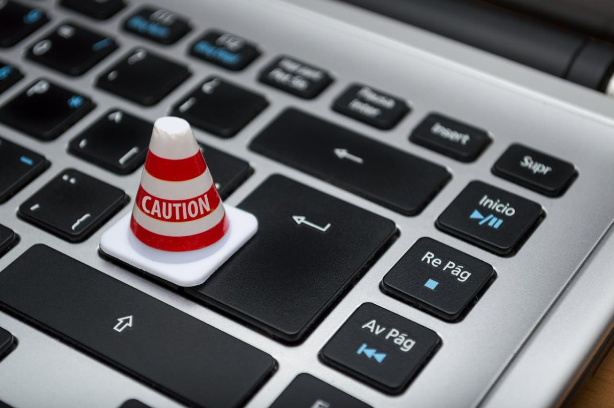 a traffic cone placed on a laptop keyboard