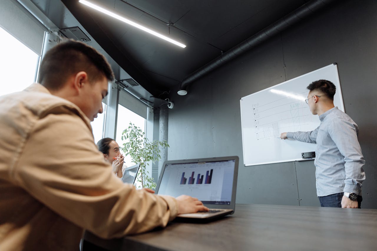 a group of diverse colleagues in an office collaboratively discussing ideas