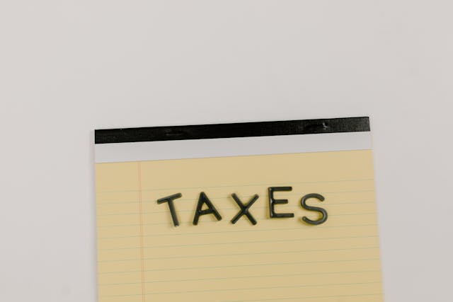 notepad with handwritten notes about taxes