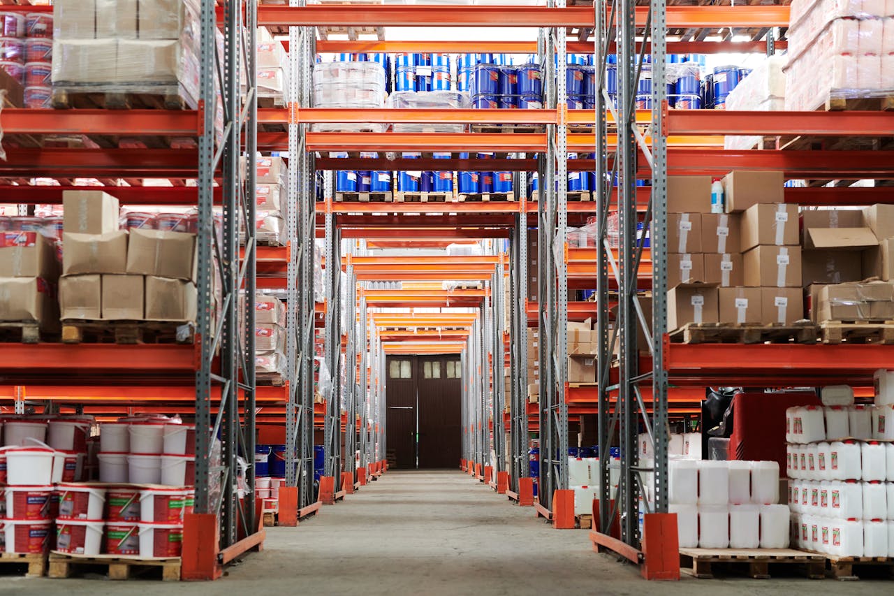 Interior view of a warehouse featuring numerous shelves loaded with boxes