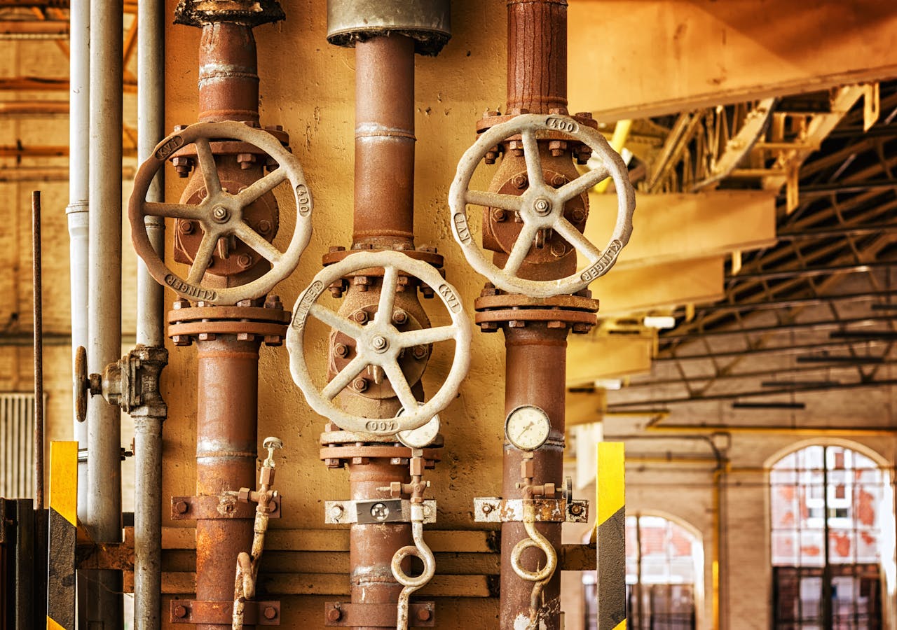 a network of pipes and valves inside a factory