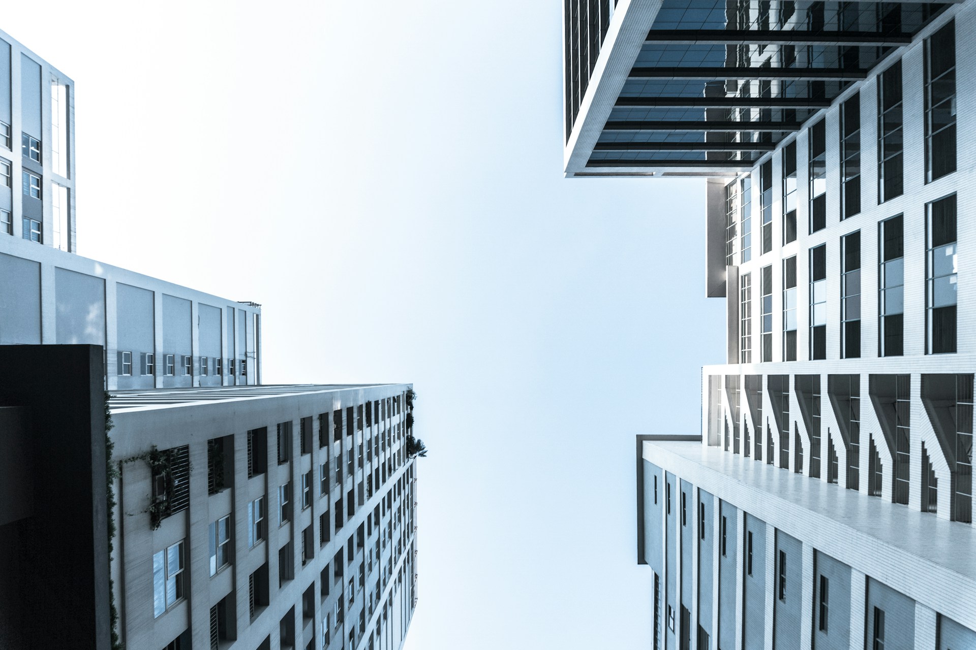 urban landscape featuring tall buildings against a bright sky