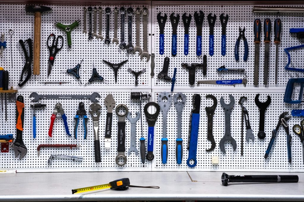 a tool-filled pegboard showcasing a variety of equipment