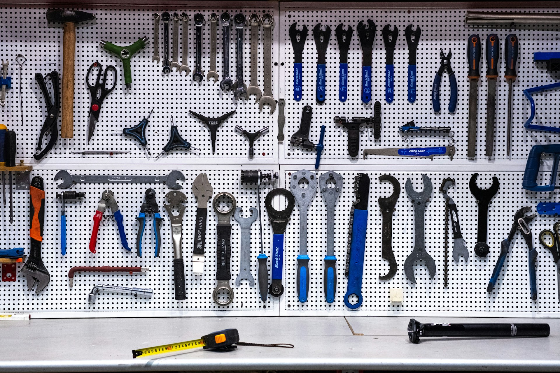 a tool-filled pegboard showcasing a variety of equipment