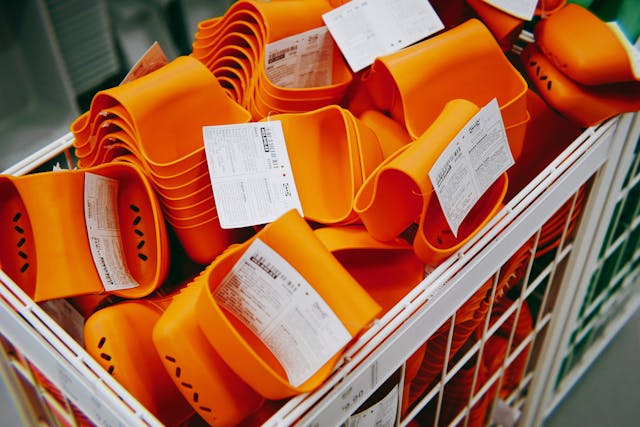 colorful basket filled with an assortment of orange plastic items