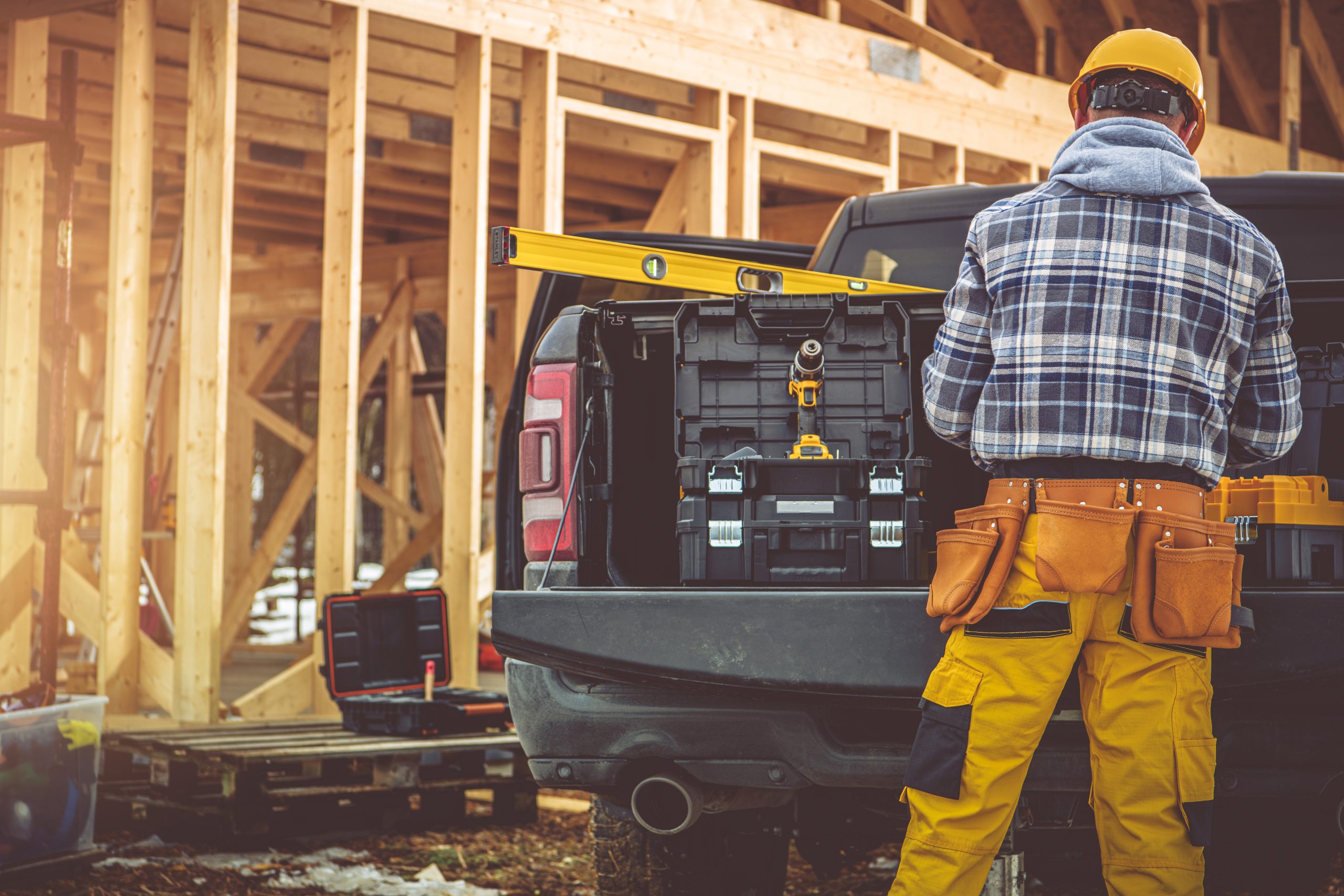 a tradie organizing tools in his commercial vehicle