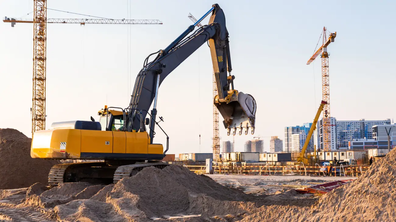 Group Tower Cranes and Excavator Silhouette